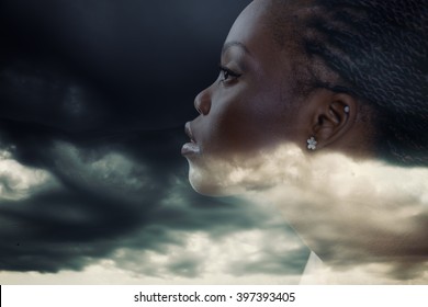 Double Exposure Portrait Of Beautiful Woman. Beauty Portrait Of Young African Woman In Profile With Storm Cloudy Sky