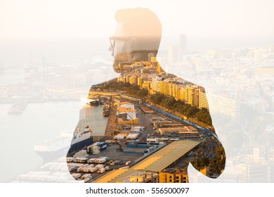 Double Exposure Portrait Of A Businessman Combinated With Spanish City Background