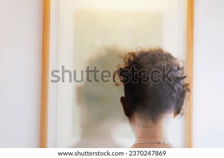 Double exposure portrait of woman from back with short pixie hair.
Bipolar, personality disorder, mental well-being.
Concept of mental problems, mental health, depression, dissociated identity.