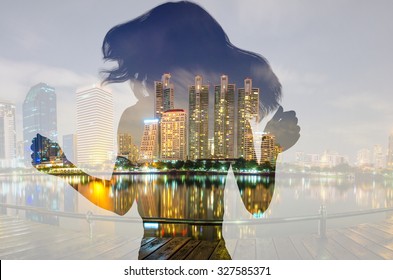 Double Exposure Portrait Of Woman Happy About City At Night.