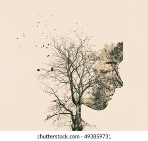 Double exposure portrait of young woman and autumn trees.