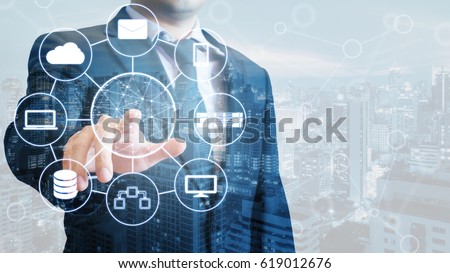 Double exposure of professional businessman connected devices world digital technology internet and wireless network on touch screen and city of business background, business and technology concept