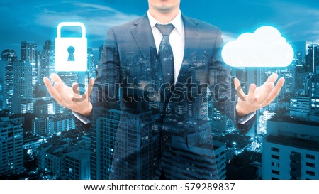Double exposure of professional businessman security protection and cloud network connection technology with cityscape in communication , business and security technology concept