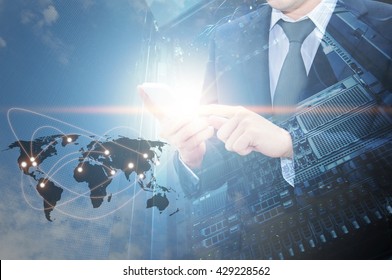 Double exposure of professional businessman using cloud in smart phone with servers technology in data center and world map network connection in IT Business concept, world map from NASA