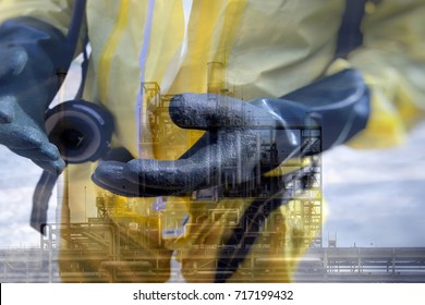 Double Exposure Of  Rescuers In A Chemical Suit Wearing Chemical Gloves And Chemical Plant Industry .