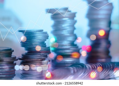 Double exposure of rows of coins for finance and business concept on city and bokeh of light background and financial status graph demonstrates business growth. - Shutterstock ID 2126558942