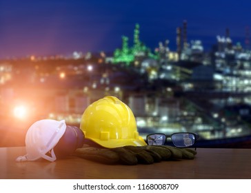 Double exposure of safety helmet  and safety equipment on blurred background of oil refinery plant  for your work .Concept for safety on work .