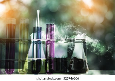 Double Exposure Of Science Laboratory Test Tubes With Bokeh And Chemical Reaction