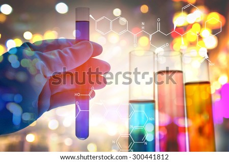Double exposure of scientist hand holding laboratory test tube