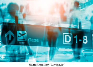 Double Exposure Of Sign At Airport With Gate Arrow For Departing Flights,People Walking In The Airport,Airline Passengers In The Airport.