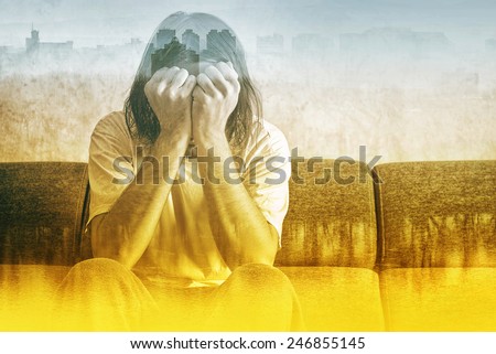 Double exposure, Social Alienation Concept, Depressed Man covering face and crying in despair.