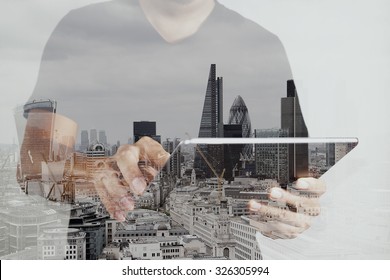 Double exposure of success businessman using digital tablet with london building and social media diagram                      