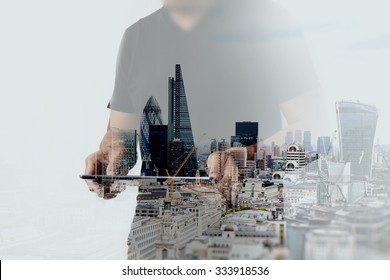 Double exposure of success businessman using digital tablet with london building and social media diagram