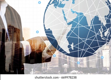 Double exposure of success businessman using tablet on city scape background, telecommunication concept. Best Internet Concept. Mixed media