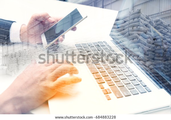 Double exposure of\
success businessman working management distribution in warehouse\
with digital tablet laptop computer and smart phone, Logistic\
Import Export business.