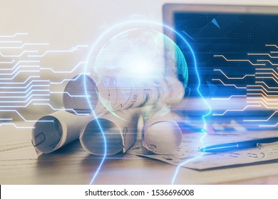 Double exposure of table with computer and brain hologram. Data innovation concept.