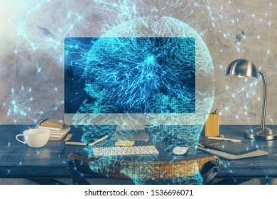 Double exposure of table with computer and brain hologram. Data innovation concept.