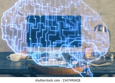 Double exposure of table with computer and brain hologram. Data innovation concept.