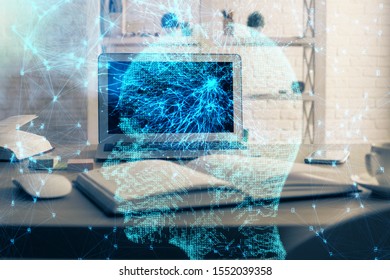 Double exposure of table with computer and brain hologram. Data innovation concept.