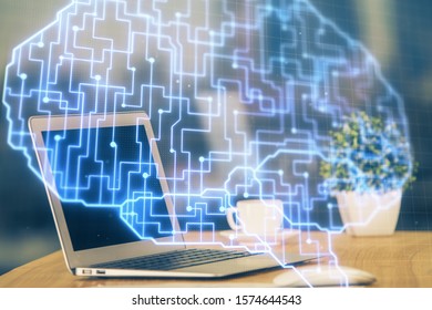 Double exposure of table with computer and brain hologram. Data innovation concept.