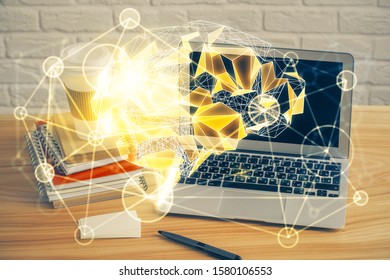 Double exposure of table with computer and brain hologram. Data innovation concept.