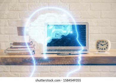 Double exposure of table with computer and brain hologram. Data innovation concept.