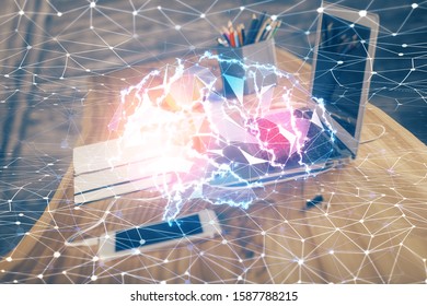 Double exposure of table with computer and brain hologram. Data innovation concept.