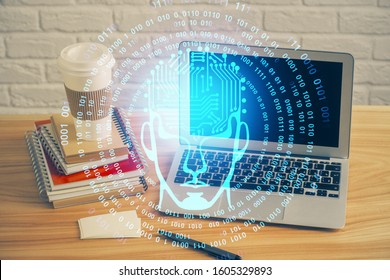 Double exposure of table with computer and brain hologram. Data innovation concept.