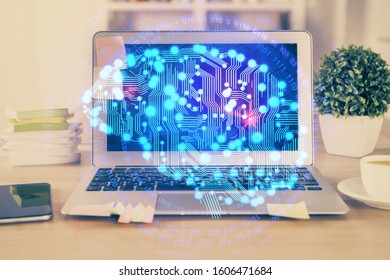 Double exposure of table with computer and brain hologram. Data innovation concept.