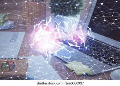 Double exposure of table with computer and brain hologram. Data innovation concept.