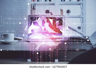 Double exposure of table with computer and brain hologram. Data innovation concept.