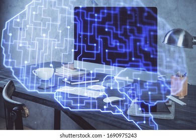 Double exposure of table with computer and brain hologram. Data innovation concept.