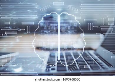 Double exposure of table with computer and brain hologram. Data innovation concept.