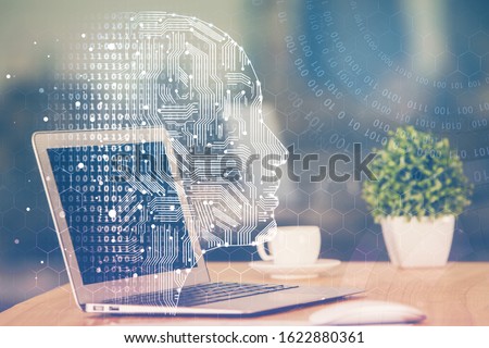 Double exposure of table with computer and brain hologram. Data innovation concept.