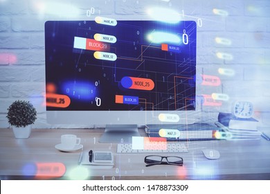 Double exposure of table with computer on background and data theme hologram. Data technology concept.