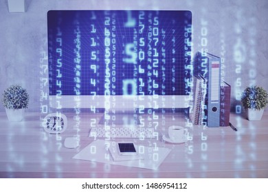 Double exposure of table with computer on background and data theme hologram. Data technology concept.
