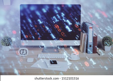 Double exposure of table with computer on background and data theme hologram. Data technology concept.