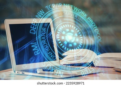 Double exposure of table with computer on background and data theme hologram. Data technology concept.
