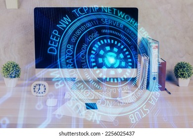 Double exposure of table with computer on background and data theme hologram. Data technology concept.
