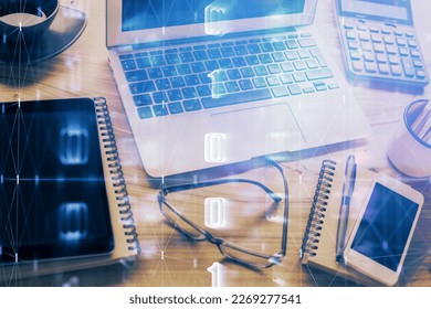Double exposure of table with computer on background and data theme drawing. Concept of innovation.