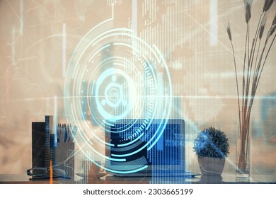 Double exposure of table with computer on background and data theme hologram. Data technology concept.