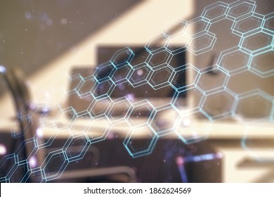 Double exposure of technology hologram with hexagon and modern desktop with laptop on background. Research and development software concept