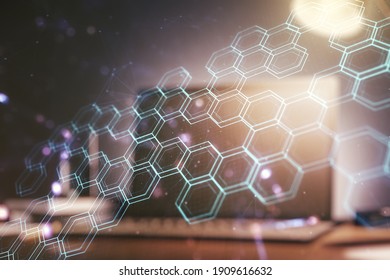 Double exposure of technology hologram with hexagon on laptop background. Research and development software concept