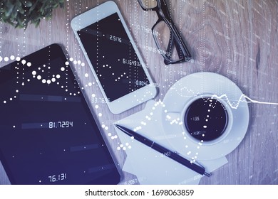 Double exposure of technology theme drawing over work table desktop. Top view. Global data analysis concept.