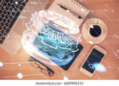 Double exposure of technology theme drawing over work table desktop. Top view. Global data analysis concept.