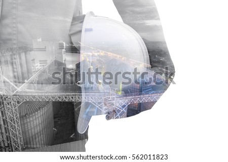 Double exposure Torso of engineer or worker hold in hand white helmet for workers security factory industry background  on white background. Set of storage tanks raw material feed mills
