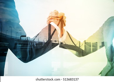 Double Exposure Of Two Business Persons Shaking Hands And Bridge Skyline, Relationship Conceptual Abstract