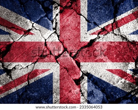Double exposure of Union Jack flag with cracks in gravel. A symbol of disintegration or division is depicted. Steps toward collapse. Useful for basemaps or report descriptions