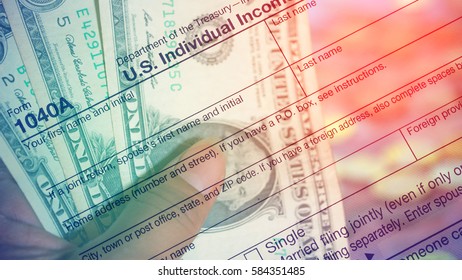 Double Exposure US Tax Form 1040 With Dollar And Coin. Tax Form Law Document Usa Mathematics Business Concept