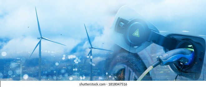 Double exposure of vehicle electric car charge battery with wind turbine and blue sky blur bokeh cityscape on panoramic background. Idea nature electric energy generate electricity. Green eco concept. - Shutterstock ID 1818047516